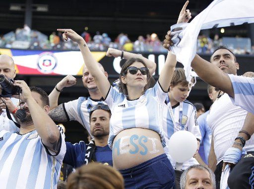 A fan with Messi painted on her belly waits for Argentina to play Chile at the Copa America Centenario USA 2016 Finals at MetLife Stadium in East Rutherford, New Jersey on June 26, 2016. Chile defeated Argentina 4-2 in penalty kicks and won there ...