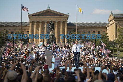 President Barack Obama waves to the crowd at a campaign event for Democratic presidential candidates Hillary Clinton in Philadelphia on September 13, 2016. Photo by Kevin Dietsch\/