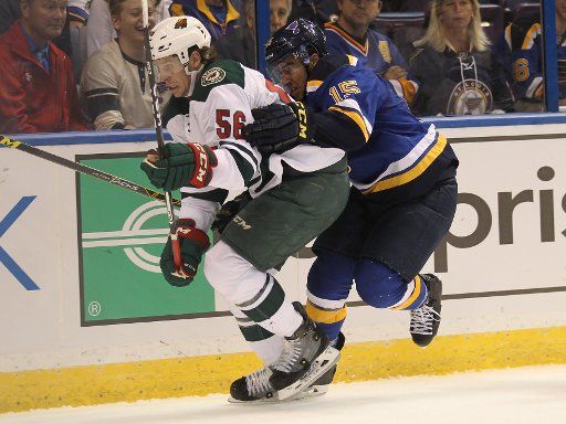 St. Louis Blues Robby Fabbri holds Minnesota Wild Erik Haula in the first period at the Scottrade Center in St. Louis on October 13, 2016. St. Louis defeated Minnesota 3-2. Photo by Bill Greenblatt\/