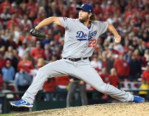 Los Angeles Dodgers Clayton Kershaw earns the save beating the Washington Nationals in game 5 of the National League Division Series at Nationals Park on October 13, 2016. Los Angeles will face the Chicago Cubs in the NLCS after defeating ...