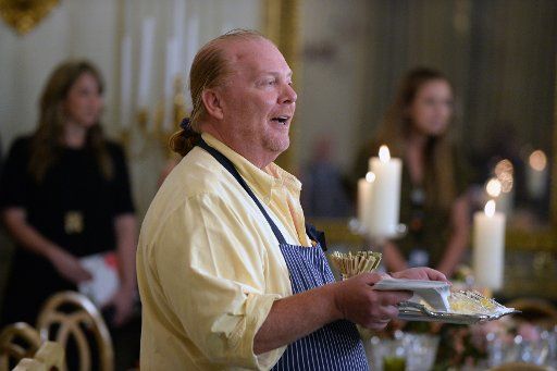 Guest chef Mario Batali displays a Sweet Potato Agnolotti and gives samples to the press during a preview of the State Dinner in the State Dining Room of the White House in Washington, DC on October 17, 2016. U.S. President Barack Obama will ...