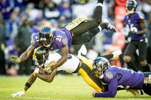 Pittsburgh Steelers wide receiver Antonio Brown is tackeled by the Baltimore Ravens\