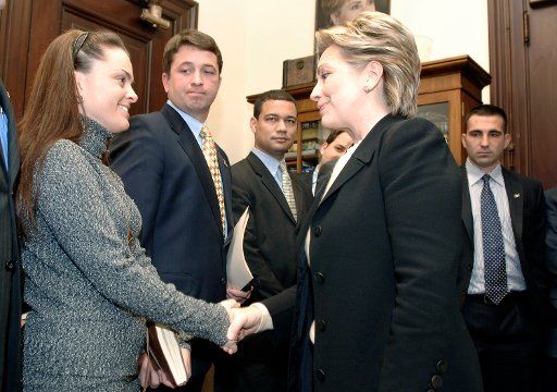 Sen. Hillary Clinton (D-NY) (R) meets with veterans of the war in Iraq who are visiting on the Hill to lobby against the Bush administration\
