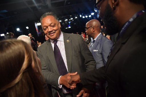 Rev. Jesse Jackson shakes hands prior to the Vice Presidential Debate between Gov. Mike Pence (R-IL) and Sen. Tim Kaine (D-VA) at Longwood University in Farmville, Virginia on October 4, 2016. Photo by Kevin Dietsch\/