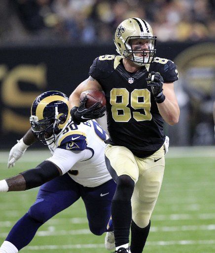 New Orleans Saints tight end Josh Hill (89) runs past Los Angeles Rams defensive tackle Michael Brockers (90) in route to 35 yard gain at the Mercedes-Benz Superdome in New Orleans November 27, 2016. Photo by AJ Sisco\/