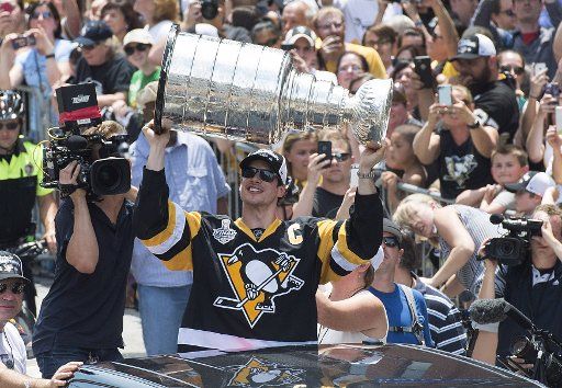 Pittsburgh Penguins team captain and playoff MVP Sidney Crosby holds the Stanley Cup during the Penguins\