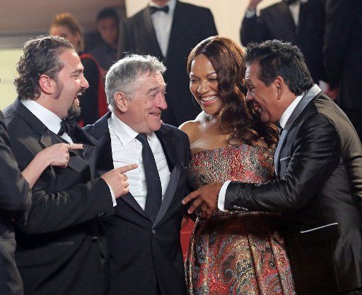 (From L to R) Jonathan Jakubowicz, Robert De Niro, Grace Hightower and Roberto Duran arrive on the steps of the Palais des Festivals before the screening of the film "Hands of Stone" during the 69th annual Cannes International Film Festival in ...