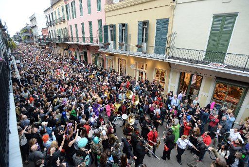Arcade Fire and the Preservation Hall Jazz Band march down Royal Street as they play during a traditional jazz funeral for rock legend David Bowie in the French Quarter in New Orleans, Louisiana, on January 16, 2016. Thousands of fans crowded the ...
