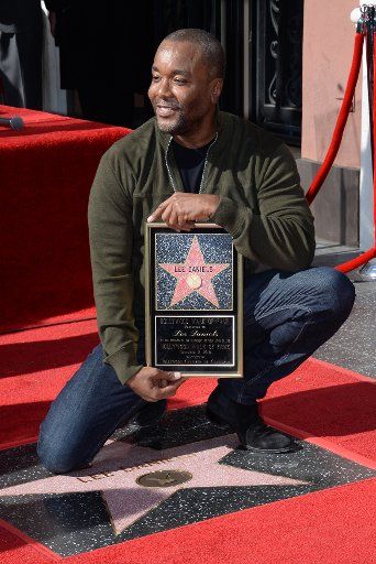 Director Lee Daniels holds a replica plaque during an unveiling ceremony honoring him with the 2,595th star on the Hollywood Walk of fame in Los Angeles on December 2, 2016. Photo by Jim Ruymen\/