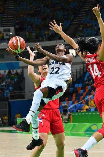 Olivia Epoupa (22) of France is blocked on shot during the Women\