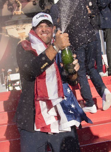 USA team member Patrick Reed celebrates after the United States defeated Europe 17-11 to win the 2016 Ryder Cup at Hazeltine National Golf Club in Chaska, Minnesota, on October 2, 2016. USA defeated Europe for the first time since 2008. Photo by ...