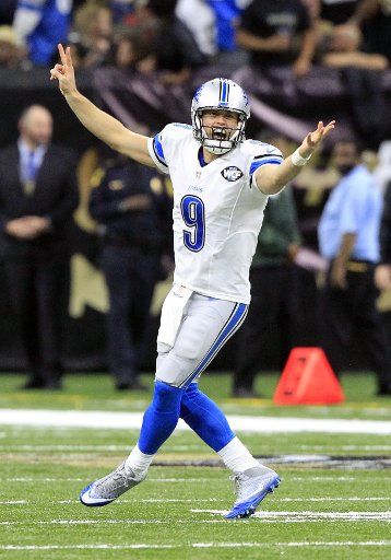 Detroit Lions quarterback Matthew Stafford (9) signals to teammates that they are going for two points after a touchdown against the New Orleans Saints at the Mercedes-Benz Superdome in New Orleans December 4, 2016. Photo by AJ Sisco\/