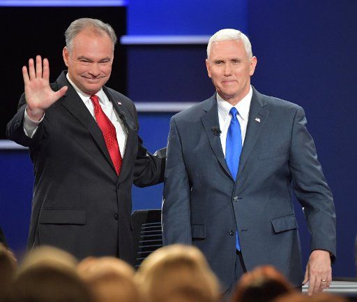 Republican Vice Presidential candidate Gov. Mike Pence (R-IL) looks on as Democratic Vice Presidential candidate Sen. Tim Kaine (D-VA) waves prior to the Vice Presidential Debate at Longwood University in Farmville, Virginia, on October 4, 2016. ...