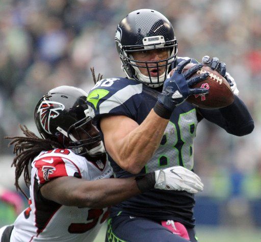 Seattle Seahawks tight end Jimmy Graham (88) catches a pass in front of defending Atlanta Falcons strong safety Kemal Ishmael (36) for 25 yards at CenturyLink Field in Seattle, Washington, on October 16, 2016. Graham caught six passes for 89 yards ...