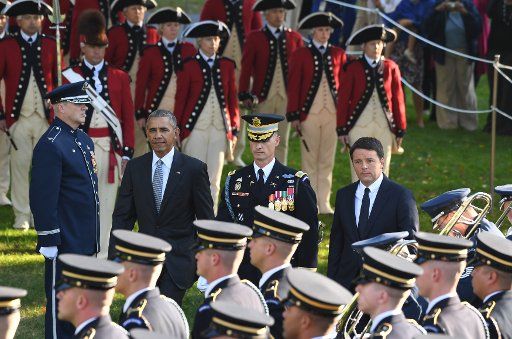 U.S. President Barack Obama and Italian Prime Minister Matteo Renzi review the troops during the official State Visit welcoming ceremony on the South Lawn of the White House in Washington, DC, on October 18, 2016. Photo by Pat Benic\/