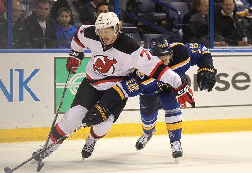 New Jersey Devils Jon Merrill uses his arm to block St. Louis Blues Jori Lehtera of Finland from getting to the puck in the first period at the Scottrade Center in St. Louis on December 15, 2016. Photo by Bill Greenblatt\/