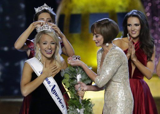 2016 Miss America Betty Cantrell puts the crown on Miss Arkansas Savvy Shields who wins the 2017 Miss America at the Miss America Competition at Boardwalk Hall in Atlantic City, New Jersey, on September 11, 2016. Photo by John Angelillo\/