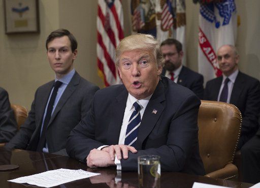 President Donald Trump speaks next to Jared Kushner, senior advisor and son-in-law, prior to a listening session with cyber security experts in the Roosevelt Room of the White House in Washington D.C., January 31, 2017. Photo by Molly Riley\/