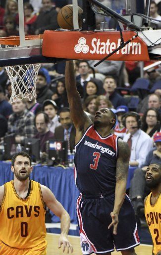 Washington Wizards guard Bradley Beal (3) scores against Cleveland Cavaliers forward Kevin Love (0) in the first half at the Verizon Center in Washington, D.C. on February 6, 2017. Photo by Mark Goldman\/