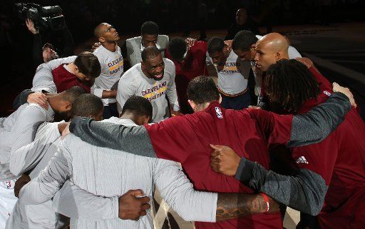 Cleveland Cavaliers Lebron James talks to his teammates prior to the Cavs game against the Orlando Magic at Quicken Loans Arena in Cleveland on April 4, 2017. Photo by Aaron Josefczyk\/