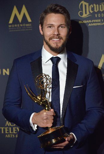 Scott Clifton holds up his Daytime Emmy for Outstanding Lead Actor in a Drama Series backstage in the press room during the 44th Annual Daytime Emmy Awards at the Pasadena Civic Auditorium in Pasadena, California on April 30, 2017. Photo by ...