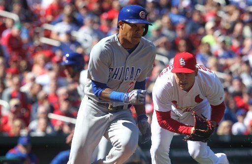St. Louis Cardinals pitcher Miguel Socolovich picks up a slow roller and throws to first to get Chicago Cubs Addison Russell in the seventh inning at Busch Stadium in St. Louis on April 6, 2017. The sacrifice scored Cubs Kris Bryant from third base ...
