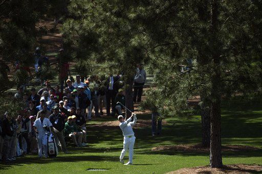 Hideki Matsuyama hits from the rough on the 7th fairway during the second round of the 2017 Masters Tournament at Augusta National Golf Club in Augusta, Georgia on April 7, 2017. Photo by Kevin Dietsch\/