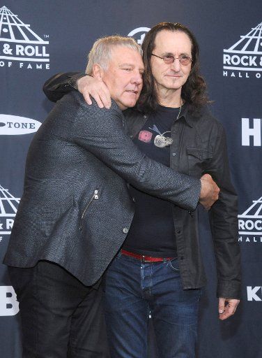 Alex Lifeson and Geddy Lee of Rush arrive in the press room at the 32nd annual Rock and Roll Hall of Fame induction ceremonies at Barclays Center on April 7, 2017 in New York City. UPI