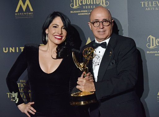 Anchor Alejandra Oraa (L) and Executive Producer\/Director Eduardo Suarez pose with their Daytime Emmy for Outstanding Entertainment Program in Spanish in the press room during the 44th Annual Daytime Emmy Awards at the Pasadena Civic Auditorium in ...