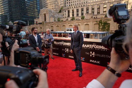 Director Michael Bay arrives on the red carpet at the Transformers The Last Knight movie premiere on June 20, 2017 in Chicago. Photo by John Gress\/