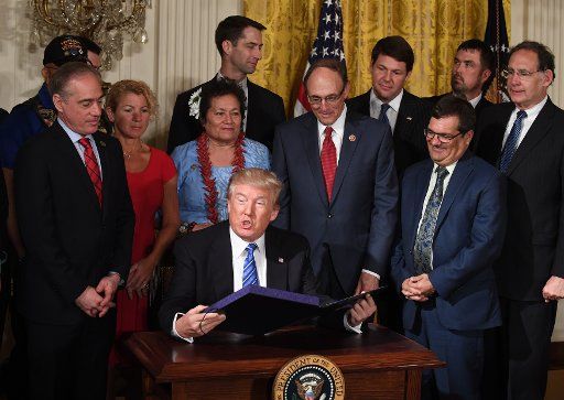 U.S. President Donald Trump speaks at the signing of the "VA Accountability and Whistleblower Protection Act" during an event in the East Room of the White House in Washington, DC on June 23, 2017. The act is designed to make it easier to fire ...
