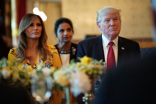 U.S. President Donald Trump (R) and first lady Melania Trump (L) listen as Indian Prime Minister Narendra Modi delivers remarks during dinner at the White House June 26, 2017 in Washington, DC. Trump and Modi met earlier today in the Oval Office to ...