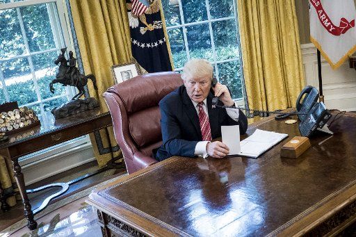 President Donald Trump speaks with Prime Minister Leo Varadkar of Ireland by telephone in the Oval Office at the White House on June 27, 2017 in Washington, DC. Trump made the call to congratulate the newly elected Prime Minister and current ...