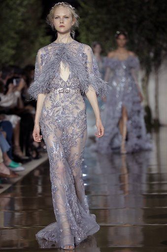 A model takes to the catwalk during the presentation of Zuhair Murad\