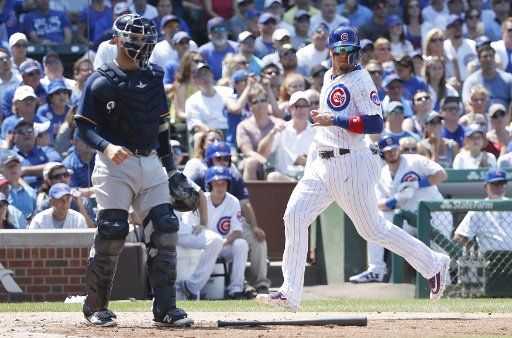 Chicago Cubs Javier Baez scores against the Milwaukee Brewers in the third inning at Wrigley Field on July 6, 2017 in Chicago. Photo by Kamil Krzaczynski\/