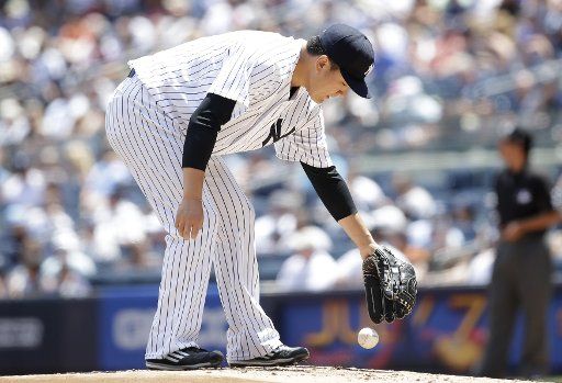 New York Yankees starting pitcher Masahiro Tanaka drops the baseball on the mound in the first inning against the Milwaukee Brewers at Yankee Stadium in New York City on July 9, 2017. Photo by John Angelillo\/