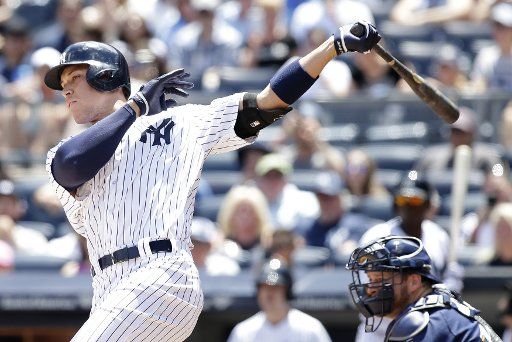 New York Yankees Aaron Judge hits a single in the first inning against the Milwaukee Brewers at Yankee Stadium in New York City on July 9, 2017. Photo by John Angelillo\/