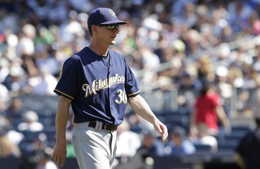 Milwaukee Brewers manager Craig Counsell walks back to the dugout after making a pitch change in the 6th inning against the New York Yankees at Yankee Stadium in New York City on July 9, 2017. Photo by John Angelillo\/