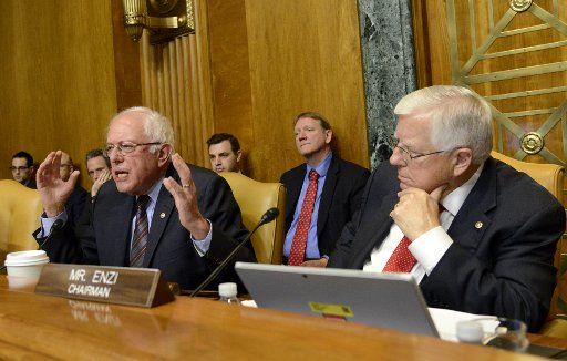 Vermont Sen. Bernie Sanders (L) sharply questions Office of Management and Budget (OMB) Director Mick Mulvaney as Chairman Mike Enzi of Wyoming listens, during a Senate Budget Committee hearing, May 25, 2017, on Capitol Hill, in Washington, D.C. ...
