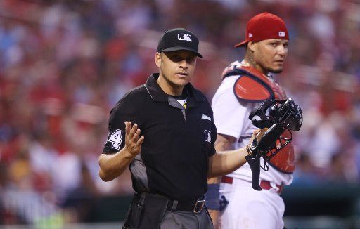 Home plate umpire Mark Wegner responds to remarks from the dugout by St. Louis Cardinals manager Mike Matheny during the fifth inning against the Los Angeles Dodgers at Busch Stadium in St. Louis on May 30, 2017. Photo by Bill Greenblatt\/