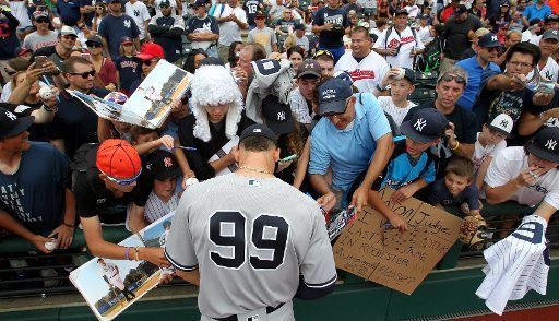 Aaron Judge signs autographs prior to the Yankees game against the Cleveland Indians at Progressive Field in Cleveland, Ohio on August 6, 2017. Photo by Aaron Josefczyk\/