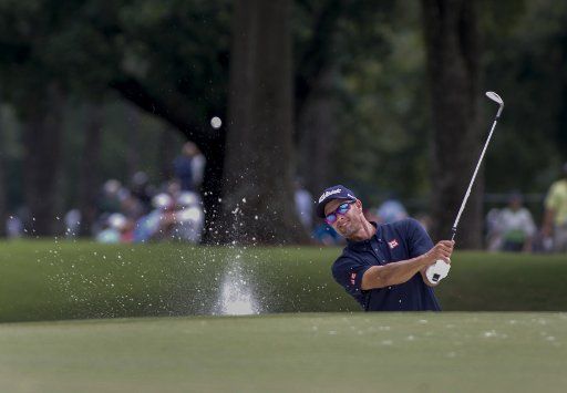 Adam Scott hits out of a sand trap on the ninth hole during his practice round at the 2017 PGA Championship at the Quail Hollow Club in Charlotte, North Carolina on August 9, 2017. Photo by Nell Redmond\/