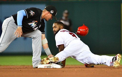 Washington Nationals left fielder Brian Goodwin (8) steals second base against Miami Marlins second baseman Dee Gordon (9) in the sixth inning at Nationals Park in Washington, D.C. on August 10, 2017. The Nationals defeated the Marlins 3-2. Photo by ...
