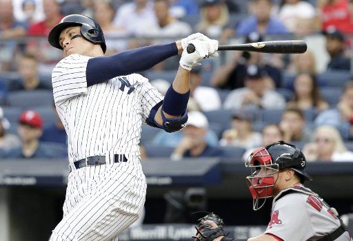 New York Yankees Aaron Judge takes a swing at a pitch and misses in the 7th inning against the Boston Red Sox at Yankee Stadium in New York City on August 12, 2017. Photo by John Angelillo\/