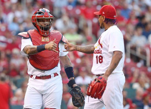 St. Louis Cardinals Yadier Molina and starting pitcher Carlos Martinez shake hands after the first inning against the San Diego Padres at Busch Stadium in St. Louis on August 24, 2017. Photo by Bill Greenblatt\/