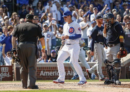 Chicago Cubs Anthony Rizzo scores against the Atlanta Braves in the fourth inning at Wrigley Field on September 1, 2017 in Chicago. Photo by Kamil Krzaczynski\/