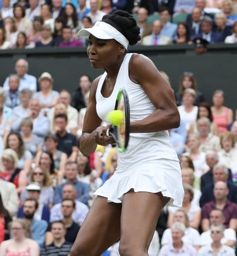 American Venus Williams returns the ball in her match against Spain\