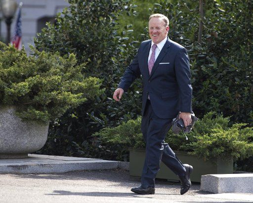 Outgoing White House Press Secretary Sean Spicer walks to the White House in Washington, D.C. on July 21, 2017. Spicer announced his resignation earlier today and will be replaced by Principal Deputy White House Press Secretary Sarah Huckabee ...