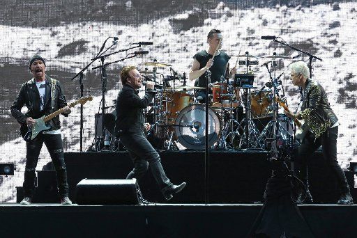 U2 members (From L to R) The Edge, Bono, Larry Mullen Jr and Adam Clayton perform in concert at the Stade de France near Paris on July 25, 2017. Photo by David Silpa\/