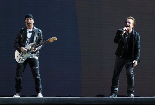 The Edge (L) and Bono of the band U2 perform in concert at the Stade de France near Paris on July 25, 2017. Photo by David Silpa\/